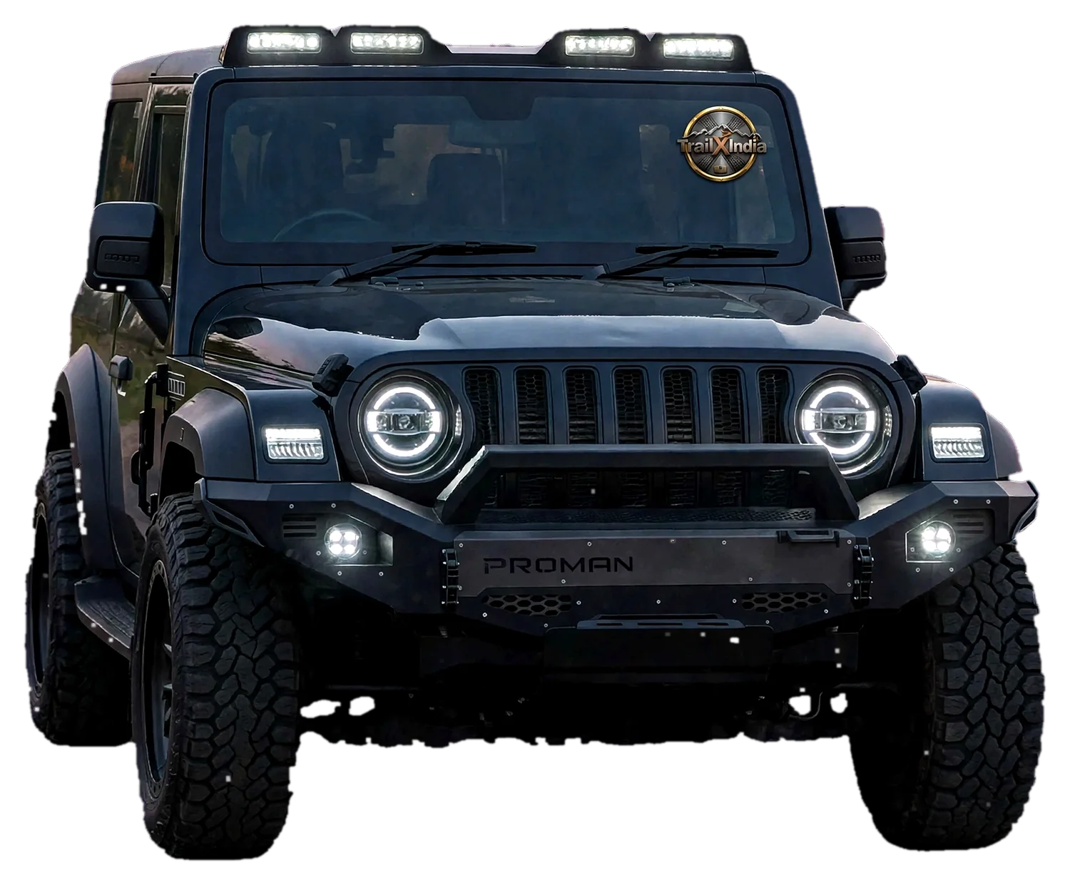 Black Mahindra Thar front view with roof light pods, halo headlights, bumper with fog lamps and all-terrain tyres